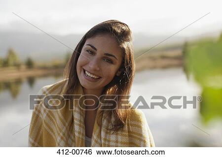 Portrait of smiling woman at lakeside View Large Photo Image Stock Photograph - Portrait of smiling woman at lakeside. Fotosearch