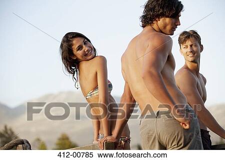 Portrait of smiling woman in bikini with friends View Large Photo Image Stock Photography - Portrait of smiling woman in bikini with friends. Fotosearch