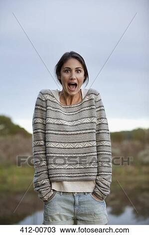 Portrait of surprised woman at lakeside View Large Photo Image Stock Image - Portrait of surprised woman at lakeside. Fotosearch