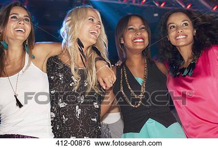 Happy women in nightclub View Large Photo Image Stock Photograph - Happy women in nightclub. Fotosearch