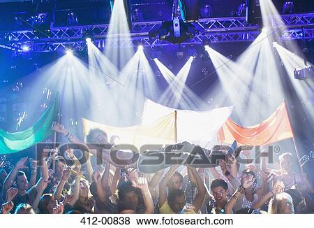 Man crowd surfing at concert View Large Photo Image Stock Photo - Man crowd surfing at concert. Fotosearch