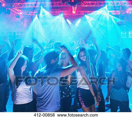 People dancing on dance floor of nightclub View Large Photo Image Stock Photo - People dancing on dance floor of nightclub. Fotosearch