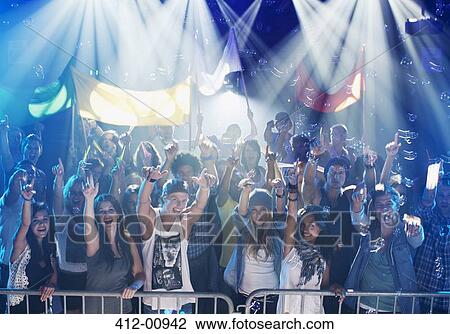 Portrait of enthusiastic crowd at concert View Large Photo Image Stock Image - Portrait of enthusiastic crowd at concert. Fotosearch