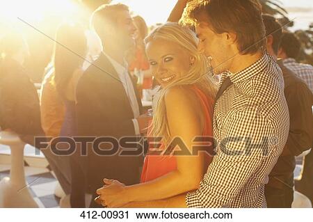 Portrait of smiling woman dancing with man on sunny balcony View Large Photo Image Stock Image - Portrait of smiling woman dancing with man on sunny balcony. Fotosearch