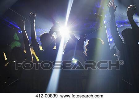 Spotlight over crowd dancing on dance floor View Large Photo Image Stock Photo - Spotlight over crowd dancing on dance floor. Fotosearch