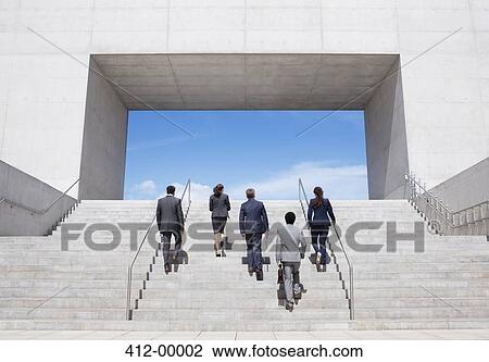 Business people ascending modern stairs View Large Photo Image Stock Image - Business people ascending modern stairs. Fotosearch