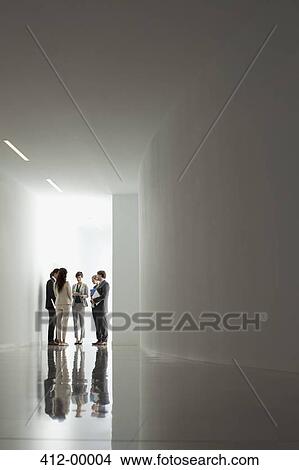 Business people meeting in corridor View Large Photo Image Picture - Business people meeting in corridor. Fotosearch