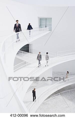 Business people walking along elevated walkways View Large Photo Image Stock Photograph - Business people walking along elevated walkways. Fotosearch
