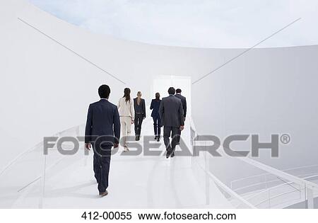 Business people walking toward doorway View Large Photo Image Stock Photography - Business people walking toward doorway. Fotosearch