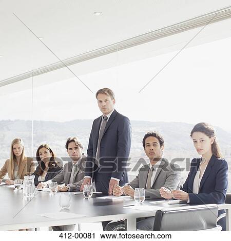 Portrait of confident business people in conference room View Large Photo Image Stock Image - Portrait of confident business people in conference room. Fotosearch