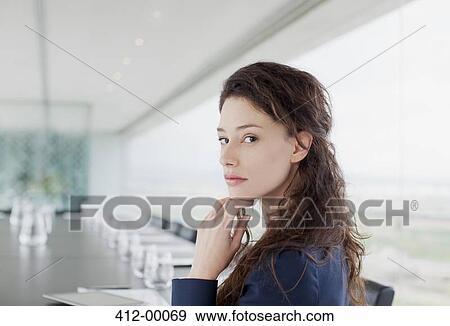 Portrait of serious businesswoman in conference room View Large Photo Image Stock Photo - Portrait of serious businesswoman in conference room. Fotosearch