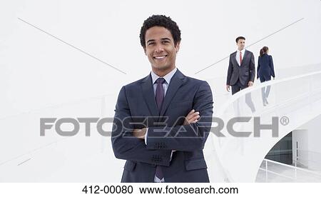Portrait of smiling businessman on elevated walkway View Large Photo Image Stock Image - Portrait of smiling businessman on elevated walkway. Fotosearch