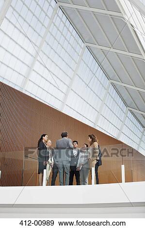 Stock Photo - Business people meeting in modern office. Fotosearch