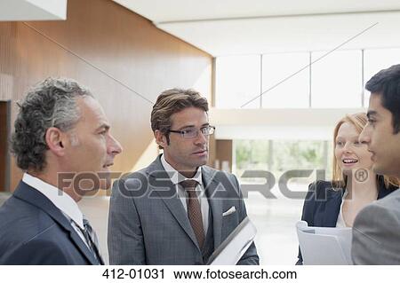 Business people talking in lobby View Large Photo Image Stock Image - Business people talking in lobby. Fotosearch