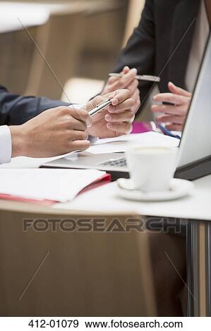 Stock Photo - Businessman and businesswoman meeting at cafe. Fotosearch