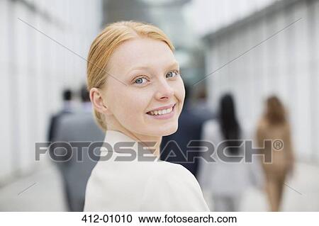Stock Image - Close up portrait of smiling businesswoman. Fotosearch