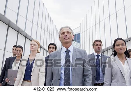 Confident business people looking ahead View Large Photo Image Stock Image - Confident business people looking ahead. Fotosearch