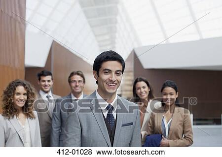 Portrait of confident business people in modern lobby View Large Photo Image Stock Photo - Portrait of confident business people in modern lobby. Fotosearch