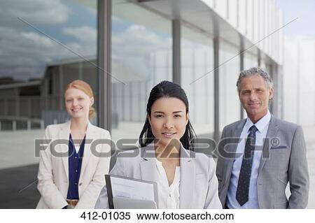 Portrait of confident business people outside building View Large Photo Image Stock Photography - Portrait of confident business people outside building. Fotosearch