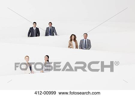 Stock Photo - Portrait of smiling business people on modern staircase. Fotosearch