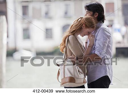 Stock Photo - Happy couple hugging. Fotosearch