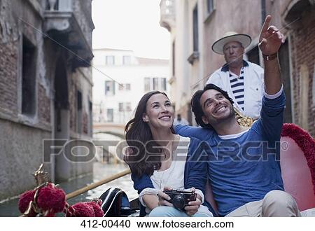 Happy couple in gondola on canal in Venice View Large Photo Image Stock Image - Happy couple in gondola on canal in Venice. Fotosearch