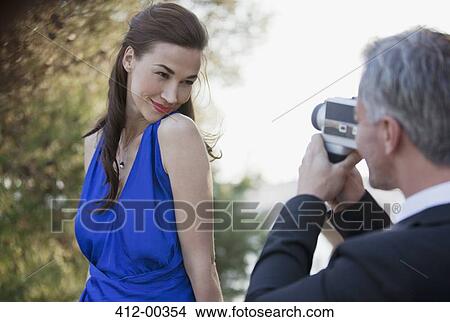 Man filming confident woman View Large Photo Image Picture - Man filming confident woman. Fotosearch