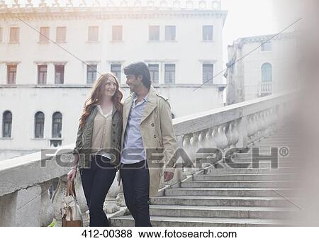 Smiling couple descending stairs in Venice View Large Photo Image Stock Photo - Smiling couple descending stairs in Venice. Fotosearch