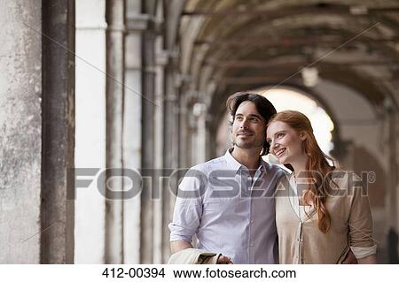 Picture - Smiling couple in corridor in Venice. Fotosearch