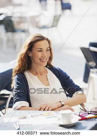 Smiling woman at sidewalk cafe View Large Photo Image Stock Image - Smiling woman at sidewalk cafe. Fotosearch