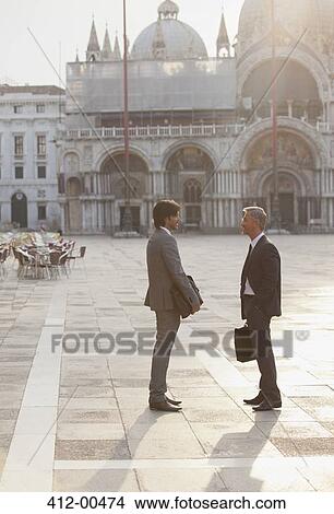Businessmen talking in St. Mark's Square in Venice View Large Photo Image Picture - Businessmen talking in St. Mark's Square in Venice. Fotosearch