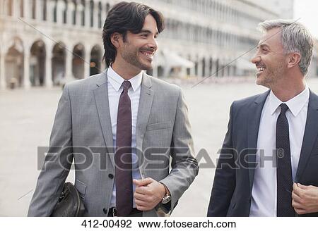 Smiling businessmen talking in St. Mark's Square in Venice View Large Photo Image Stock Image - Smiling businessmen talking in St. Mark's Square in Venice. Fotosearch