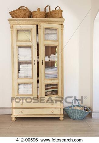 Baskets around armoire View Large Photo Image Stock Photograph - Baskets around armoire. Fotosearch
