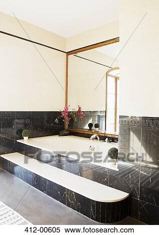 Black marble surrounding bathtub in luxury bathroom View Large Photo Image Stock Photography - Black marble surrounding bathtub in luxury bathroom. Fotosearch