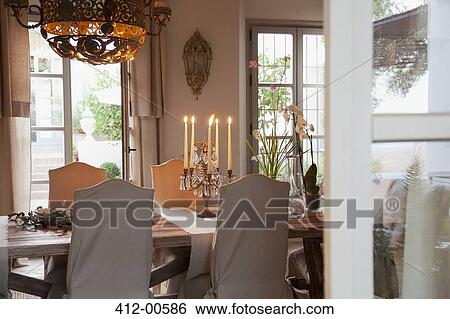 Candelabra on table in luxury dining room View Large Photo Image Stock Photograph - Candelabra on table in luxury dining room. Fotosearch