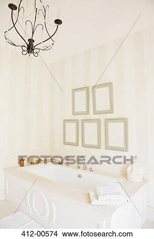 Picture - Chandelier over bathtub in luxury bathroom. Fotosearch