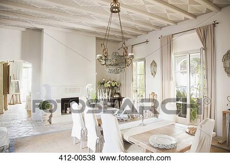 Chandelier over dining table in luxury dining room View Large Photo Image Stock Photo - Chandelier over dining table in luxury dining room. Fotosearch