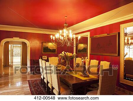 Chandelier over dining table in luxury dining room View Large Photo Image Stock Photo - Chandelier over dining table in luxury dining room. Fotosearch