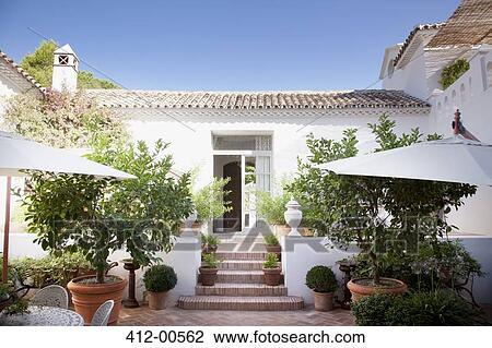 Doorway from patio into Spanish villa View Large Photo Image Stock Image - Doorway from patio into Spanish villa. Fotosearch