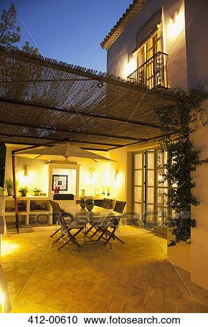 Illuminated patio of luxury villa View Large Photo Image Stock Image - Illuminated patio of luxury villa. Fotosearch