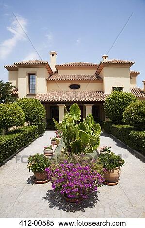 Potted plants in formal garden outside villa View Large Photo Image Stock Photography - Potted plants in formal garden outside villa. Fotosearch