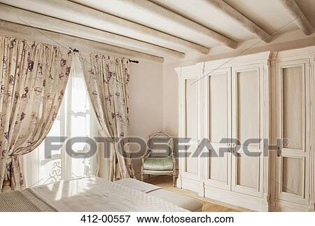 Sun shining through window into luxury bedroom View Large Photo Image Stock Photo - Sun shining through window into luxury bedroom. Fotosearch