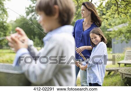 Family fishing together View Large Photo Image Stock Image - Family fishing together. Fotosearch