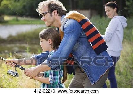 Father and daughter fishing together View Large Photo Image Stock Image - Father and daughter fishing together. Fotosearch