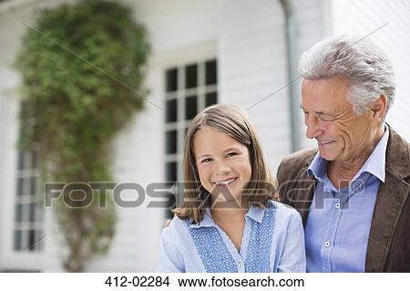 Man and granddaughter smiling outdoors View Large Photo Image Picture - Man and granddaughter smiling outdoors. Fotosearch