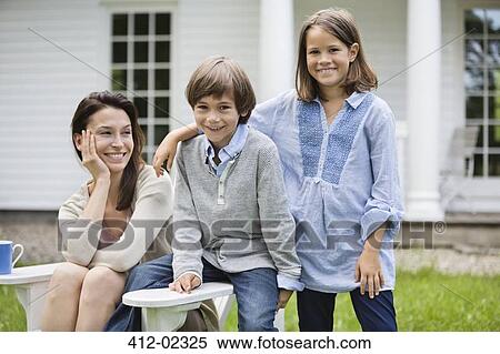 Mother and children smiling outdoors View Large Photo Image Stock Photography - Mother and children smiling outdoors. Fotosearch
