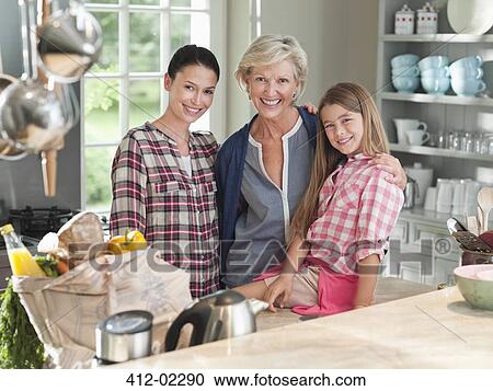 Three generations of women in kitchen View Large Photo Image Stock Image - Three generations of women in kitchen. Fotosearch