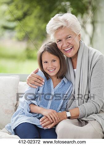 Woman and granddaughter smiling on porch swing View Large Photo Image Stock Image - Woman and granddaughter smiling on porch swing. Fotosearch