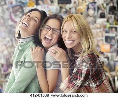 Smiling women posing together View Large Photo Image Stock Photo - Smiling women posing together. Fotosearch