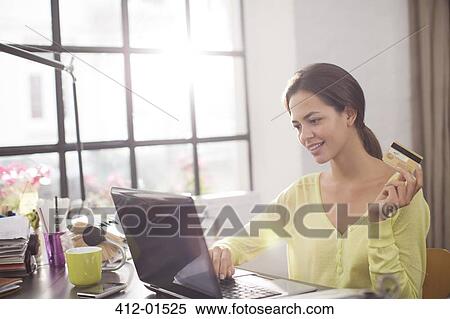 Woman shopping on laptop View Large Photo Image Stock Photography - Woman shopping on laptop. Fotosearch